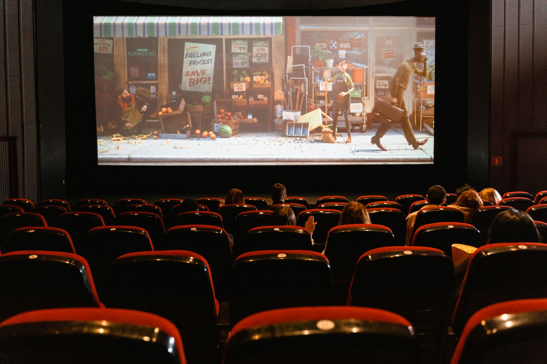 Empty seats in a small screening room, lights dimmed