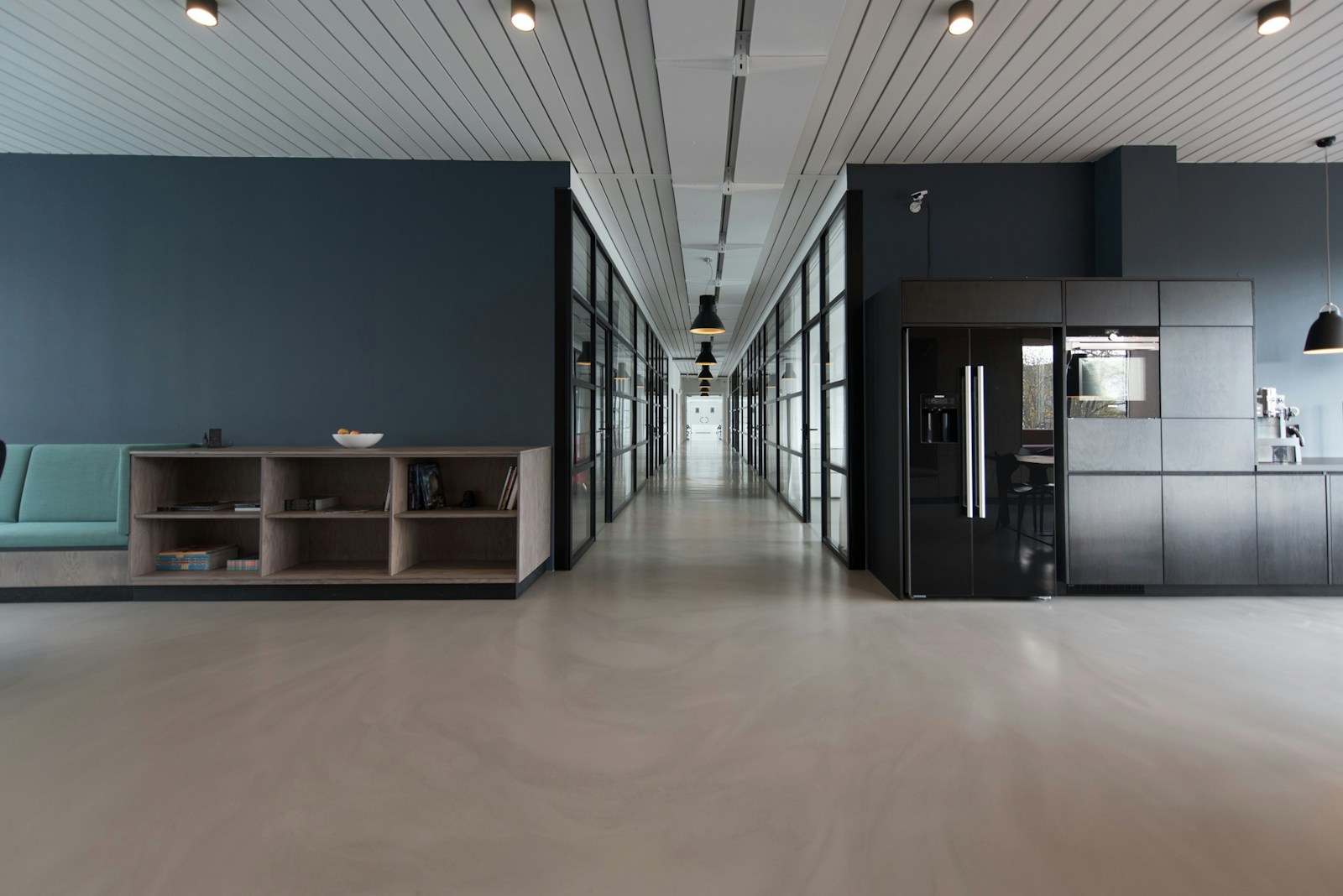 Nur Aisyah Rahmat walking through the office corridor